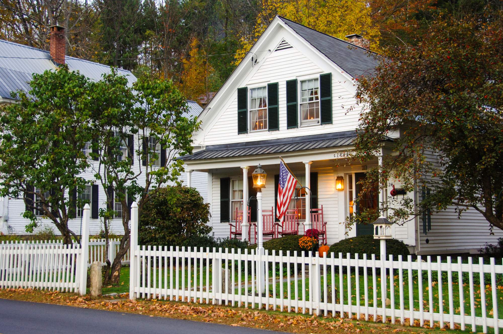 home with a white fence with Homeowners Insurance in Saginaw, Midland, Bay City, Flint, and the Surrounding Areas