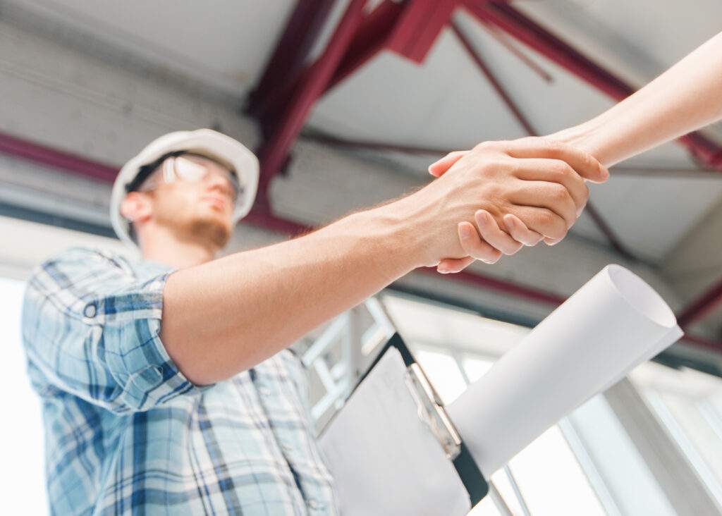 contractor shaking hands over Contractor’s Insurance Coverage in Bay City