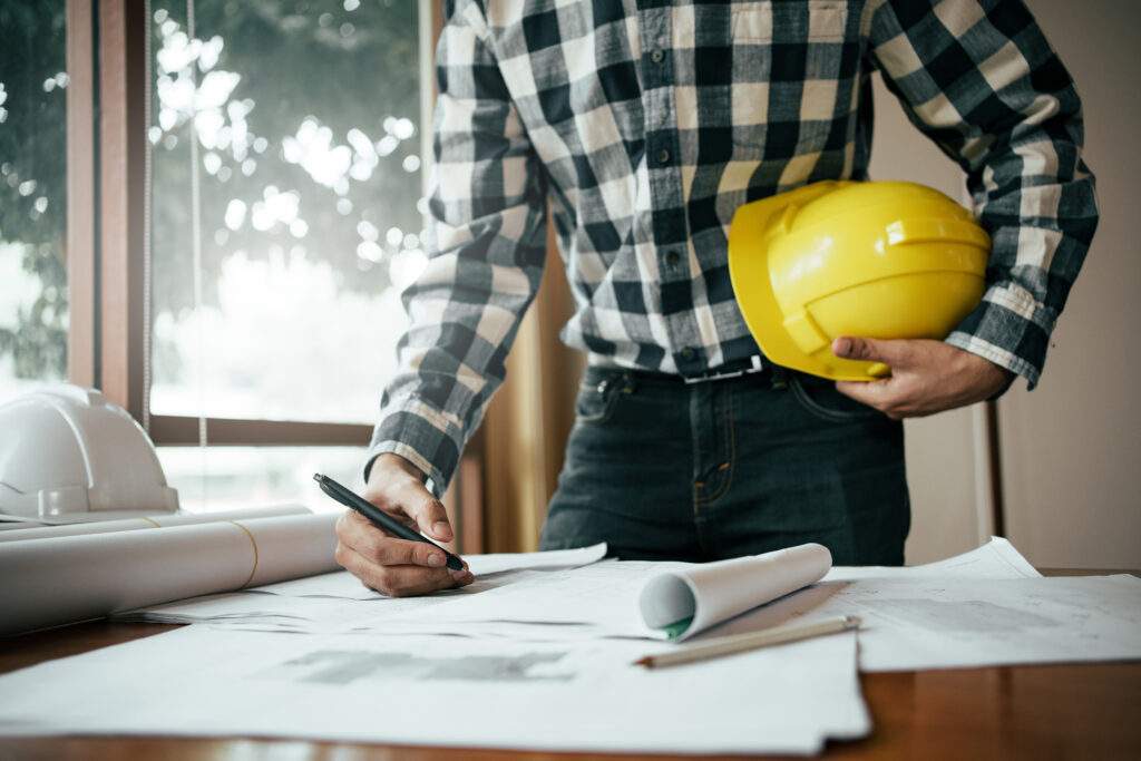 contractor signing paperwork with Specialty Trade Contractors Insurance in Saginaw
